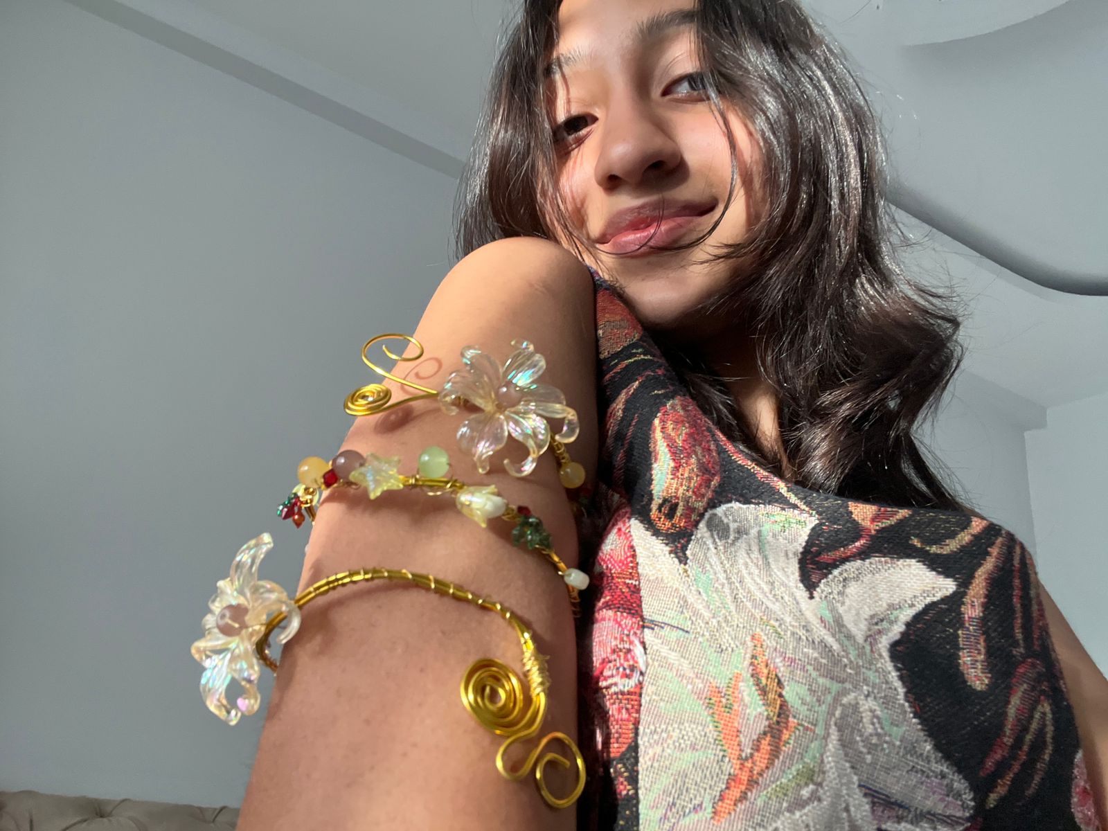 Fringe handcrafted arm jewelry worn by a customer